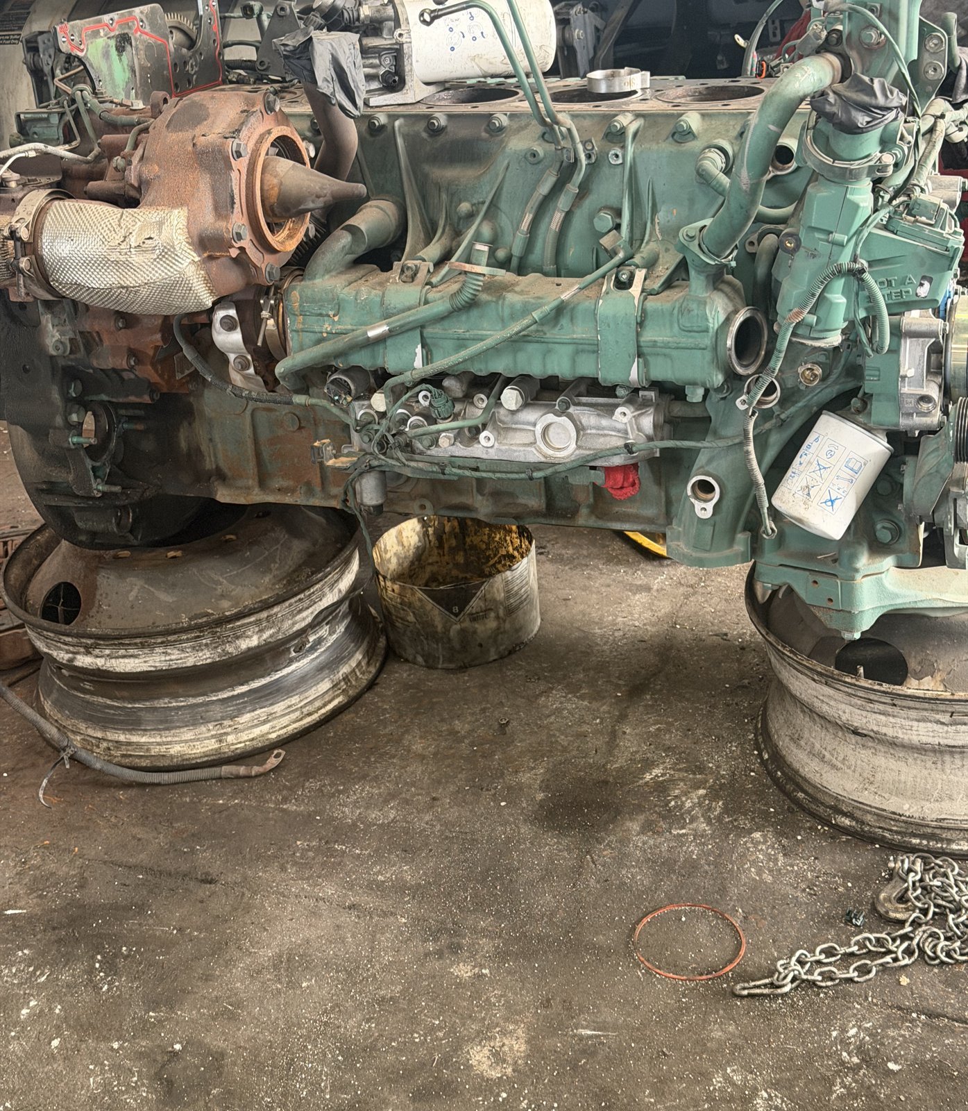 Diesel engine block sitting on the shop floor during an engine overhaul at Bawa’s in Dallas