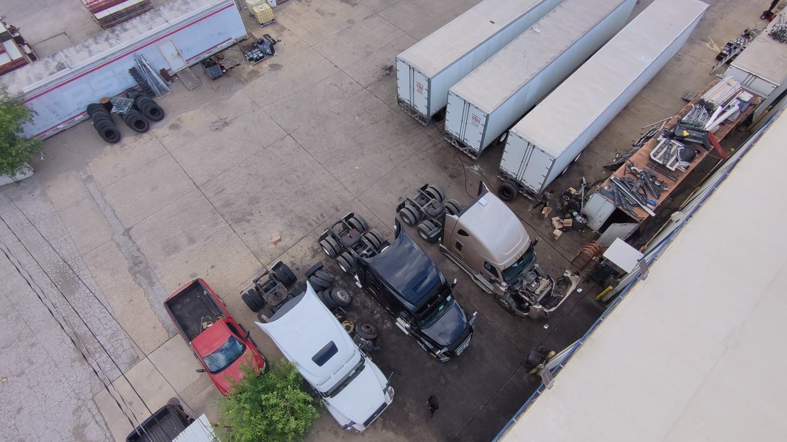 Overhead view of trailers and trucks in the Bawa’s Truck & Trailer Repair yard on Irving Blvd, Dallas